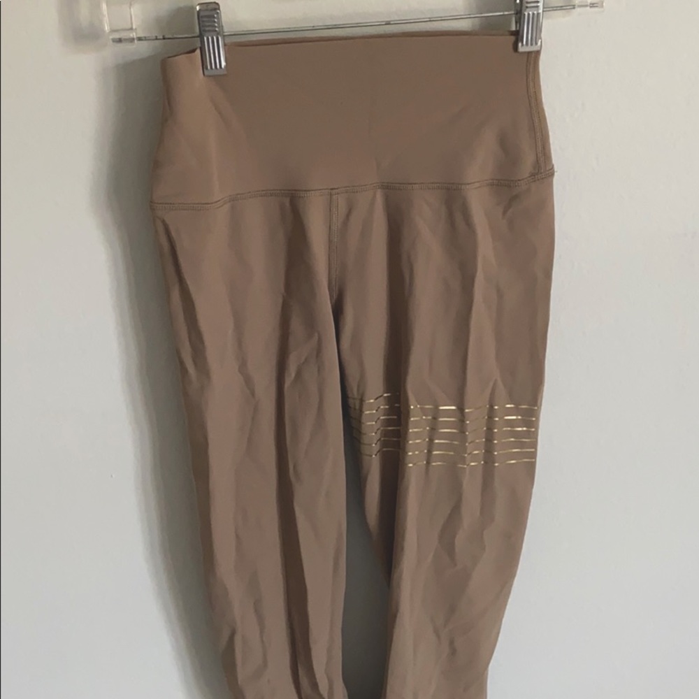 Tan alo leggings with gold stripes
